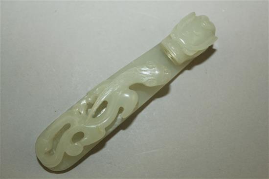 A Chinese pale celadon jade dragon belt hook, 18th / 19th century, 10cm,